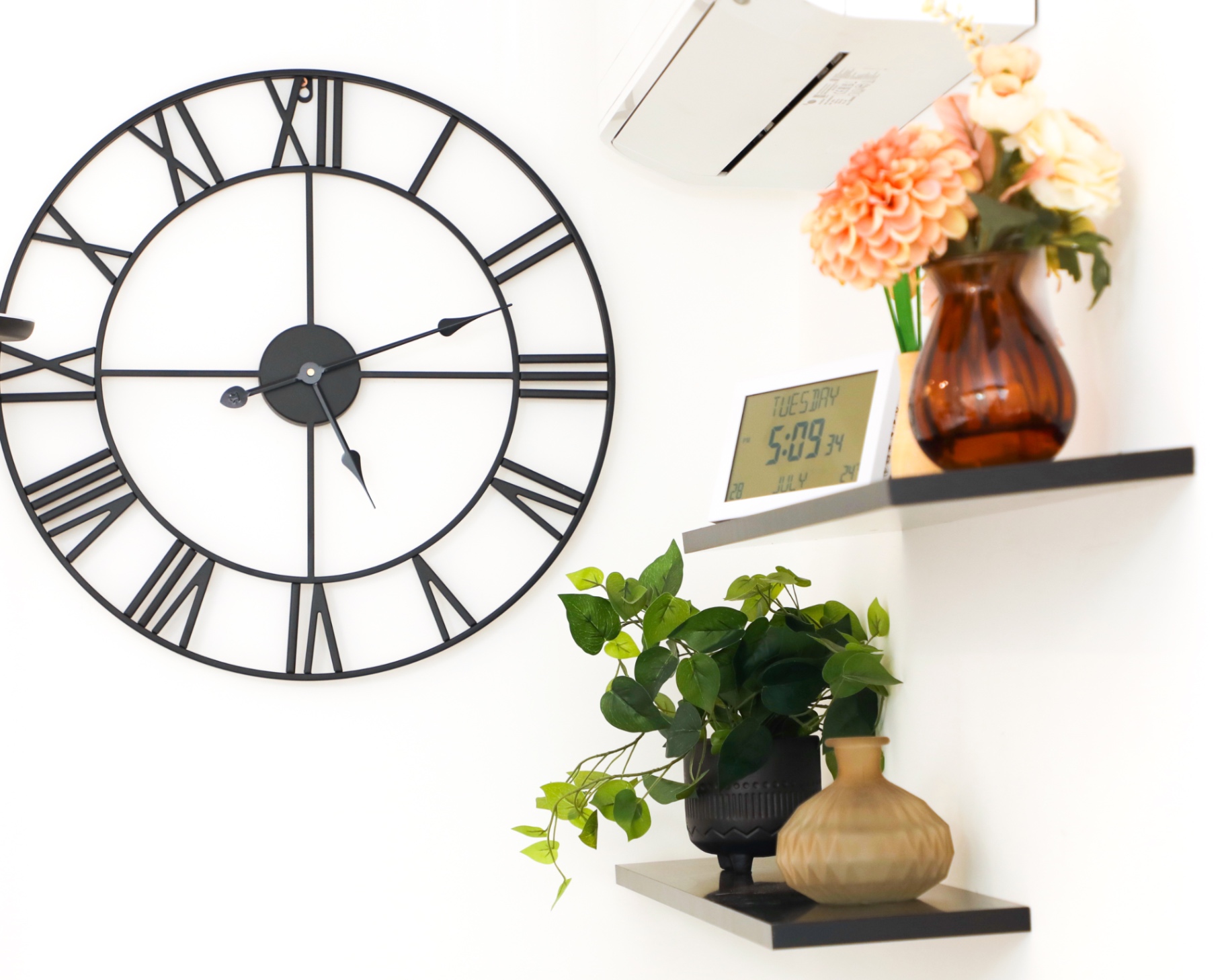 Clock, flowers and greenery in the loft